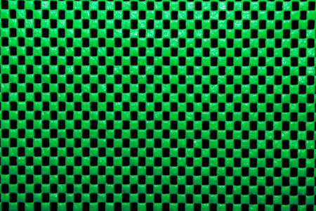 Green background with simple repeating pattern.の写真素材