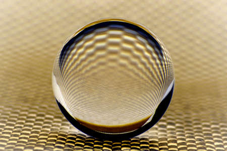 Abstract background with a glass ball in brown.の写真素材
