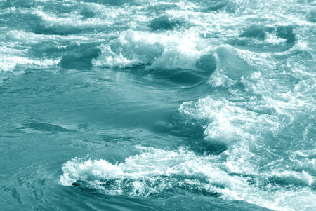 Foam on water surface. Flowing water background.