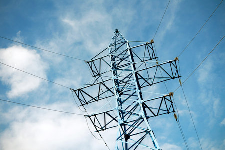 Electricity transmission pylon view against the sky. High voltage line.