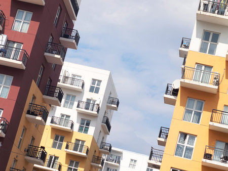 Colorful residential blocks with simple design. Residential buildings in white, red and yellow...