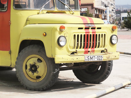 Tbilisi, Georgia. March 18, 2021. Front part of Soviet vehicle ZIL painted in yellow with red stripes.のeditorial素材