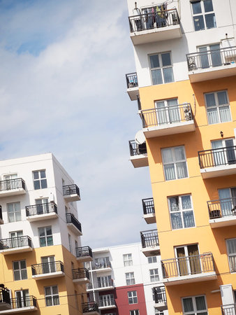 Colorful residential blocks with simple design. Residential buildings in white, red and yellow...