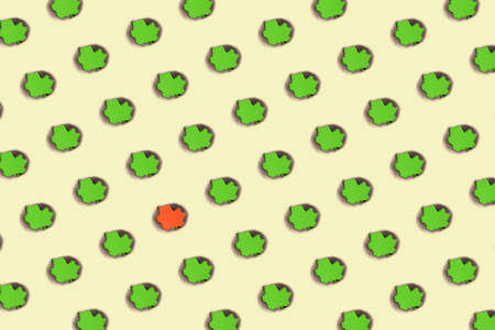 Colorful minimal pattern made of burnt spot on color paper in green and yellowの写真素材