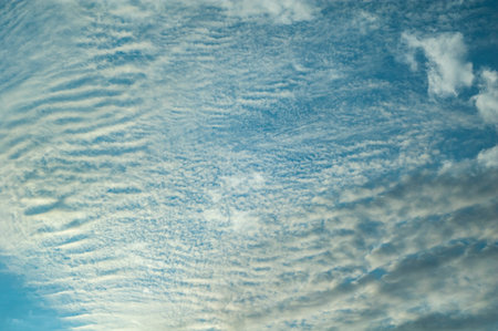 Beautiful clouds in a blue sky. Blue sky background.
