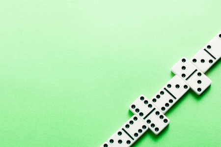 Domino layer on green background with free copy spaceの写真素材
