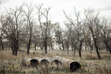 View of an abandoned park with old rusty iron pipes.の写真素材