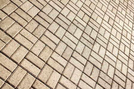 Diagonal view of pavement with geometric stone layer.