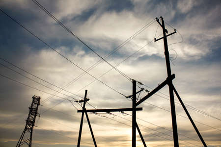 Electricity transmission pylon view against the sky during sunset.の写真素材