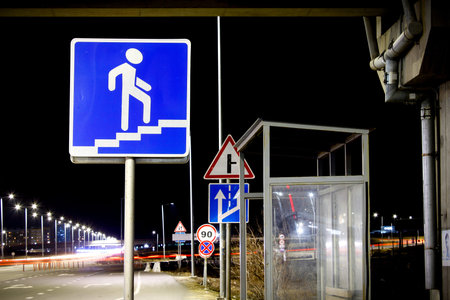 Road sign at night. Night scene with a traic signpost.