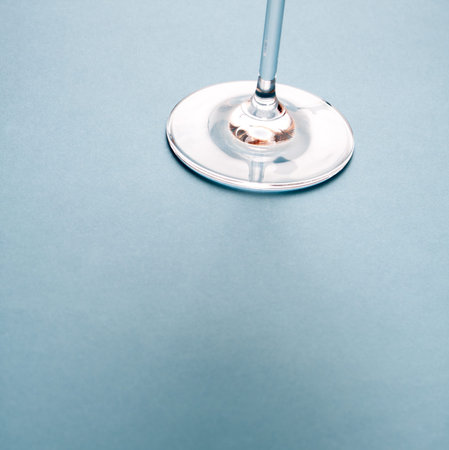 Wine glass base on blue background.
