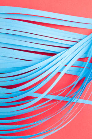 Blue cit paper strips background. Simple color paper background in blue and red.の写真素材
