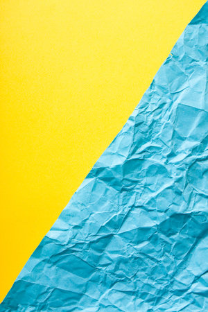 Minimalist paper flat lay in yellow and blue colors.