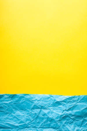 Minimalist paper background in blue and yellow.の写真素材