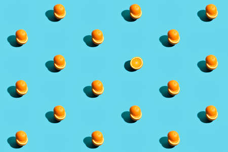 Repetitive pattern made with orange on blue background.の写真素材