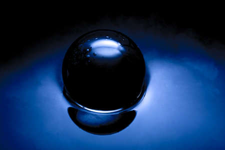 Abstract image of a glass ball, Crystan ball in dark blue.の写真素材