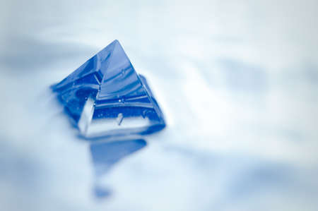 Minimalist abstract still life image of blue pyramid.の写真素材