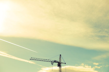 Evening view of a lifting crane against the sky.の写真素材