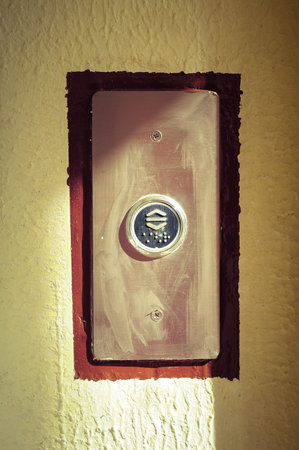 Elevator button close up view. Old lift button.