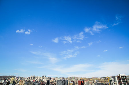 Urban landscape with building tops and free negative space sky.の写真素材