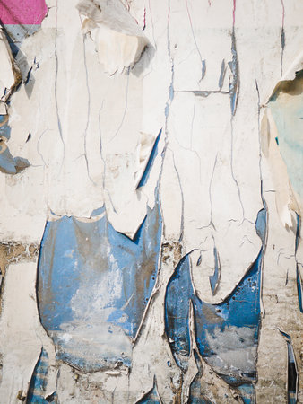 Bulletin board with scraped paper pieces.の写真素材