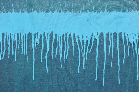 Close up image of a wooden board with blue splashesの写真素材
