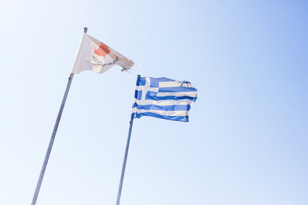 Greek and Cyprus flags together in the skyの写真素材