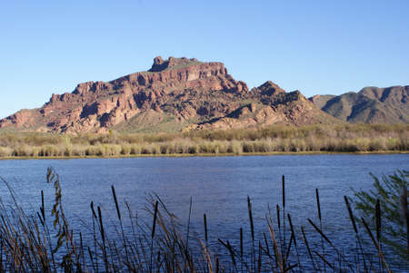 The red mountain as seen from across a lake in Arizona.の写真素材