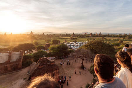 Tourists watch the sunset from the famous Pyathadar Hpaya pagoda at Bagan, Myanmar near Mandalayの写真素材