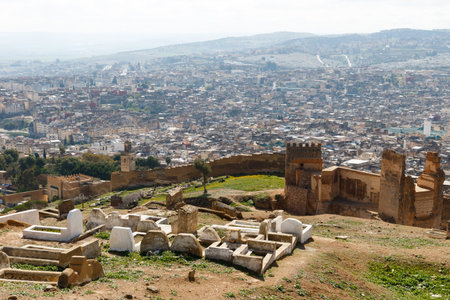 Fez, Morocco aerial view on a afternoon. The ancient city wall is in the foreground and behind it, an overview of the old neighborhood.の写真素材