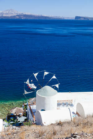 View over windmill and caldera, Santorini island, Greeceの写真素材