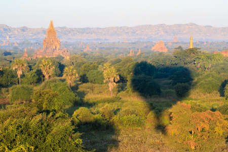 A Hot air balloon over plain of Bagan in misty morning, Myanmarの写真素材