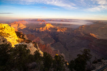 Sunrise Image of the Grand Canyon National Park with early morning haze and fog, Arizona, USA, taken from Mather Pointの写真素材