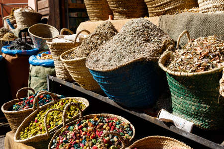 Colorful cooking Spices and flower in traditional local medina bazaar market in Marrakesh, Moroccoの写真素材