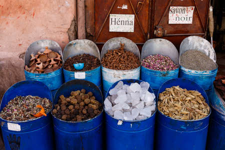 Colorful cooking Spices and flower in traditional local medina bazaar market in Marrakesh, Moroccoの写真素材