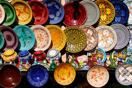 Traditional arabic handcrafted, colorful decorated plates at the bazaar in Marrakesh, Morocco, Africaの写真素材