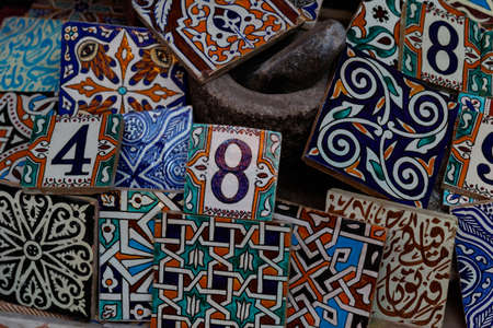 Traditional arabic handcrafted, colorful decorated tiles at the bazaar in Marrakesh, Morocco, Africaの写真素材