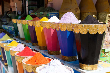 Colorful cooking Spices and flower in traditional local medina bazaar market in Marrakesh, Moroccoの写真素材