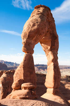 Amazing arches rock formation of the Delicate Arch formed by Colorado river during sunrise. Arches National Park, Utah, USA.の写真素材