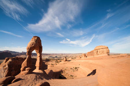 Amazing arches rock formation of the Delicate Arch formed by Colorado river during sunrise. Arches National Park, Utah, USA.の写真素材