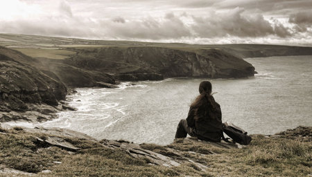 Woman by the seashore, Tintagel, Cornwall, England