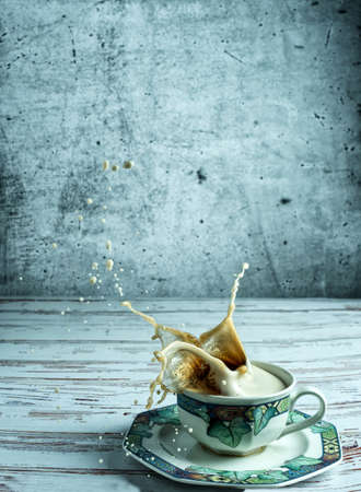 A cup of coffee with a beautiful splashの写真素材