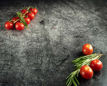 Small tomatoes on a gray backgroundの写真素材