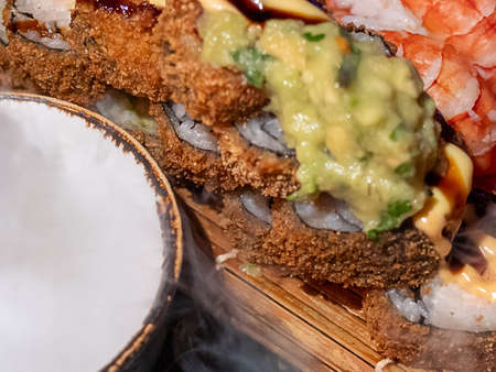 Assorted sushi nigiri and maki big set on slate. A variety of Japanese sushi with tuna, crab, salmon, eel and rolls. View from aboveの写真素材