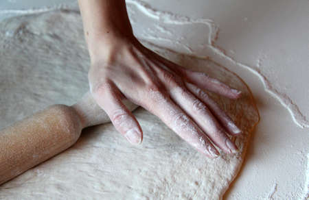 sheeting the dough by hand for confectionery fantasiesの写真素材