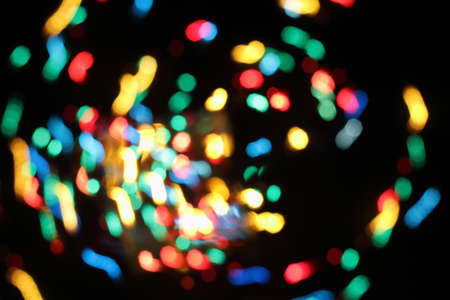 background warm lights on the Christmas festive garlandの写真素材