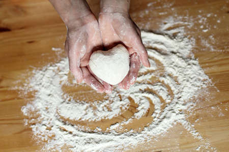 the heart of the dough in the hands of chef pastryの写真素材