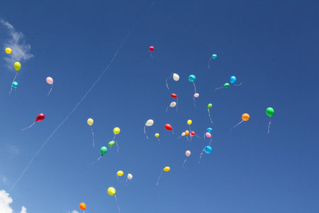 Coast of colorful balloons in the blue sky