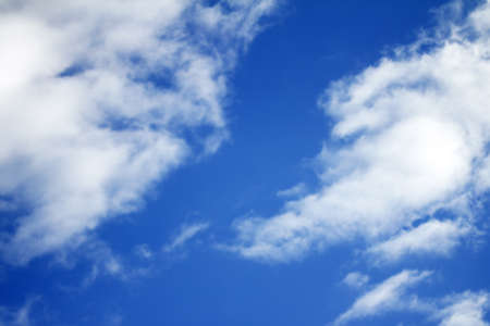 background with blue sky and white cloudsの写真素材