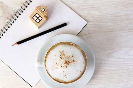 planning household tasks with a cup of coffeeの写真素材